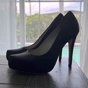 Black BCBGeneration faux snakeskin pumps